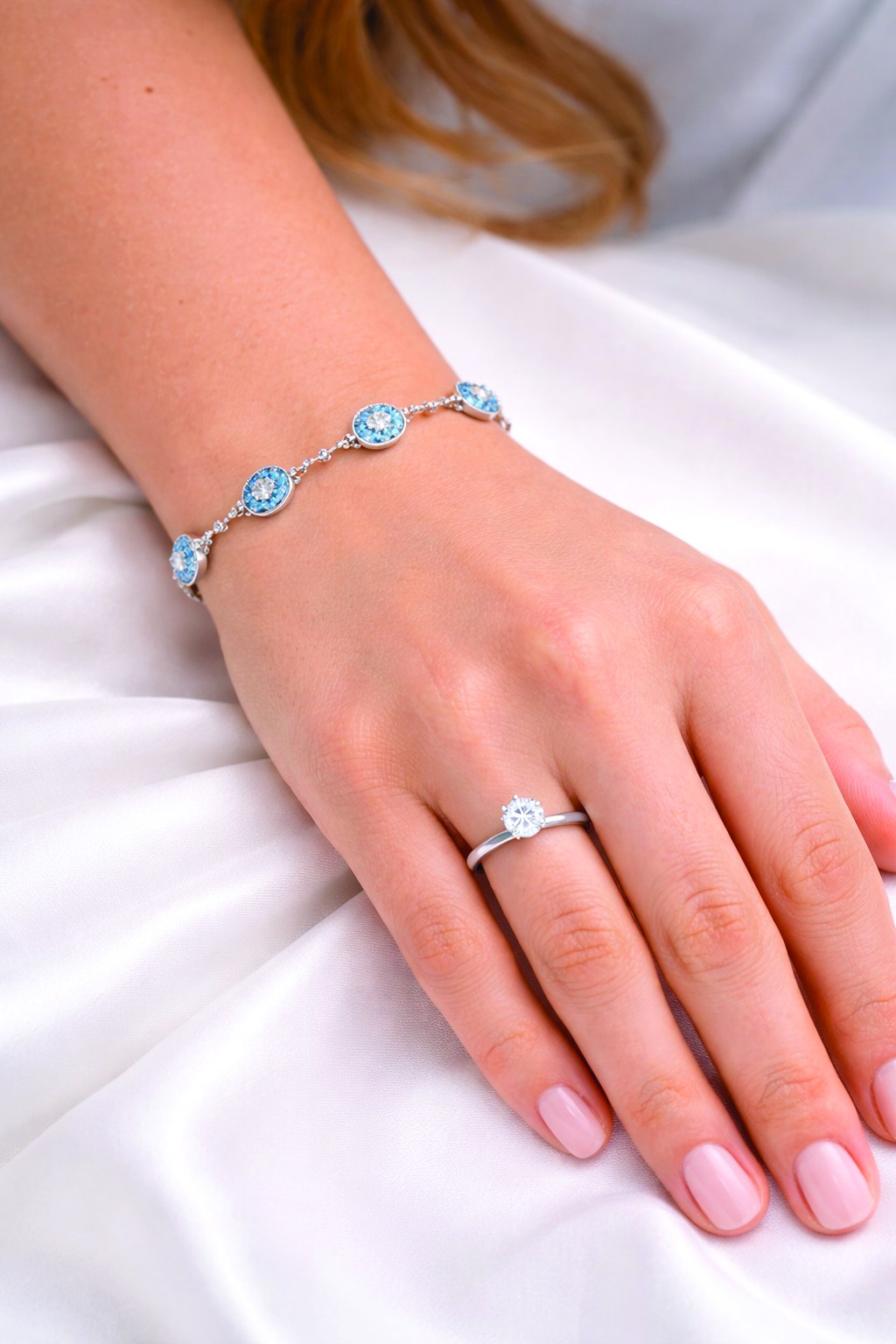 Diamond ring and bracelet on wrist