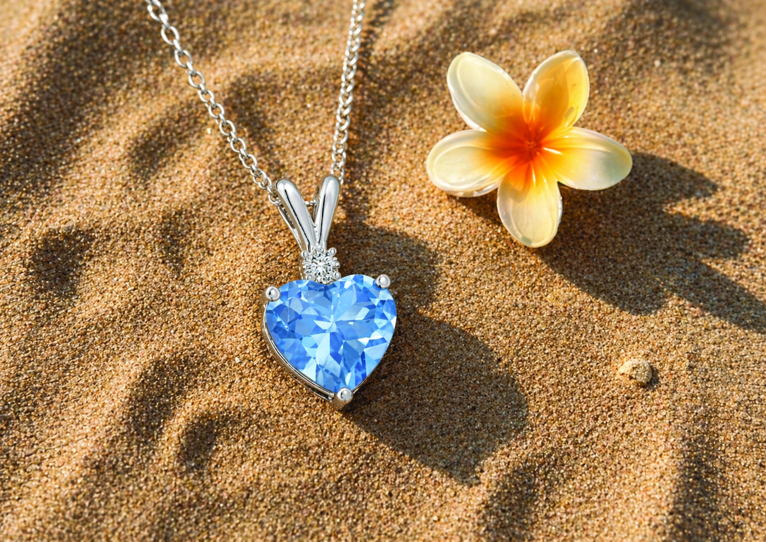 Heart pendant on sand